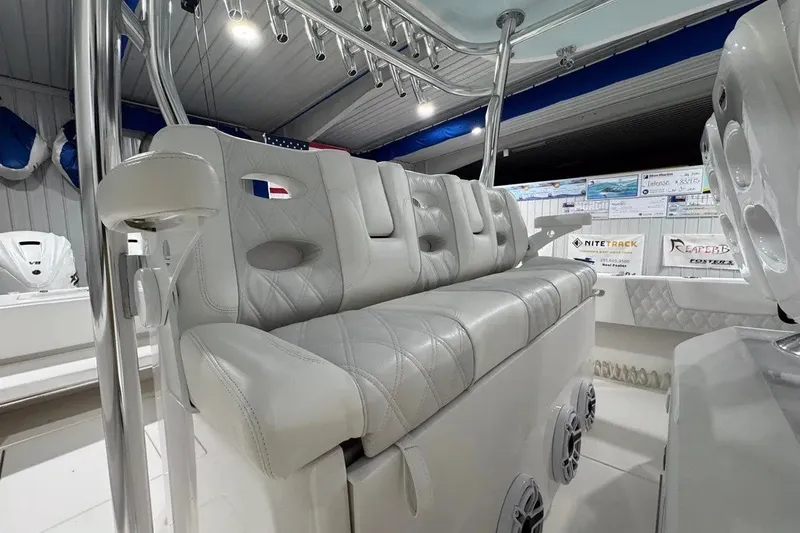 Slide: The Image of Luxurious seating on 2024 Contender 44 ST boat, featuring elegant white upholstery and modern design. - 15