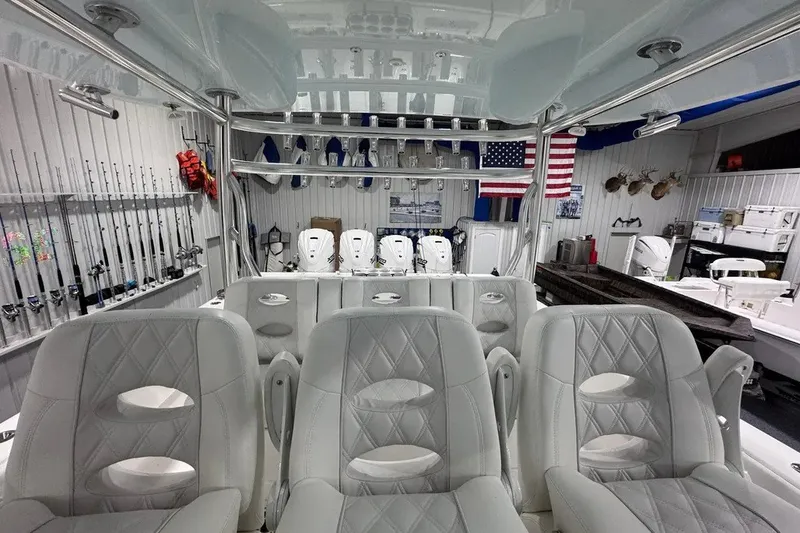 Slide: The Image of Interior of 2024 Contender 44 ST boat with luxurious seating and fishing gear. - 18