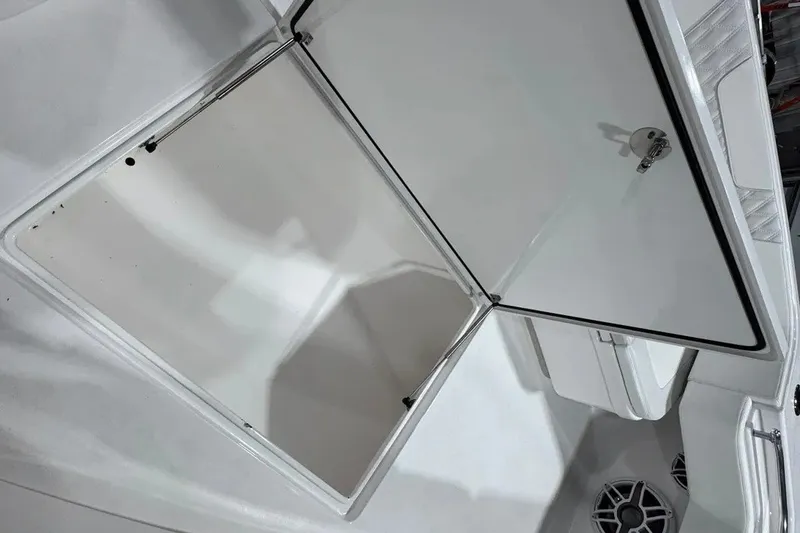 Slide: The Image of Open storage compartment on 2024 Contender 44 ST boat, showcasing interior space. - 33