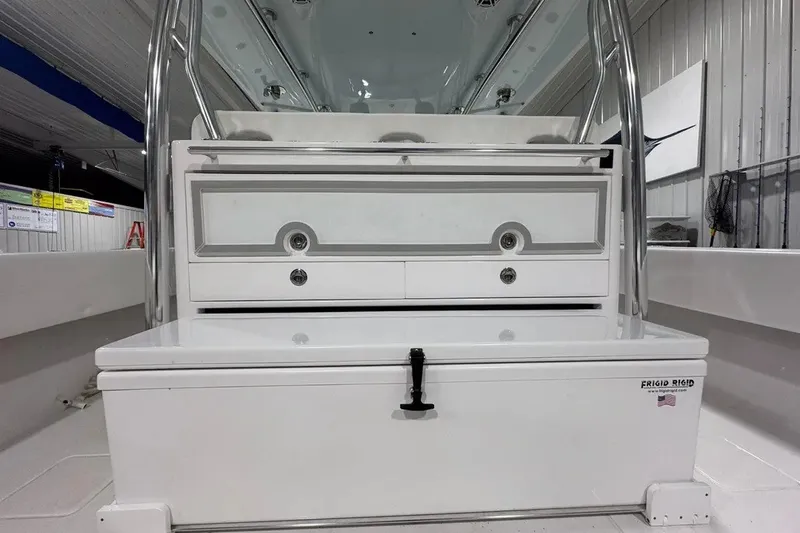 Slide: The Image of 2024 Contender 44 ST boat interior with storage compartments and stainless steel fixtures. - 21