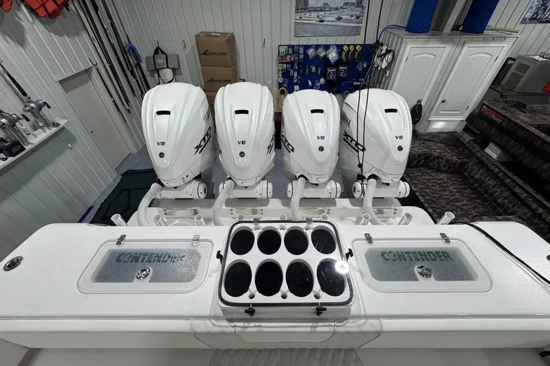 Slide: The Image of 2024 Contender 44 ST boat with four V8 engines in a showroom setting. - 24
