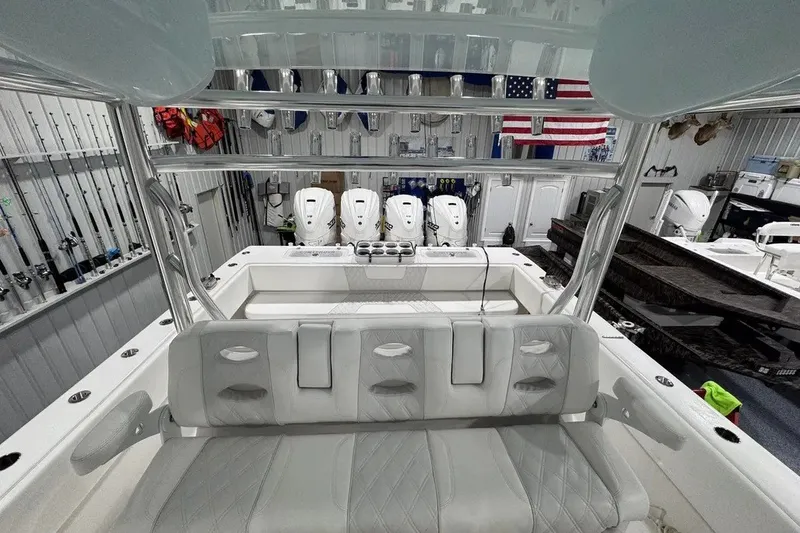 Slide: The Image of 2024 Contender 44 ST boat interior with seating and multiple outboard engines. - 17