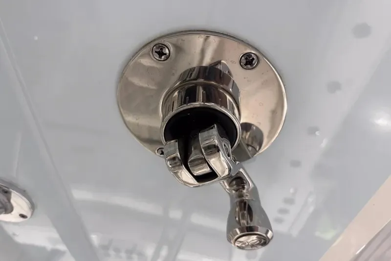 Slide: The Image of Close-up of a metal fitting on a 2024 Contender 44 ST boat. - 36