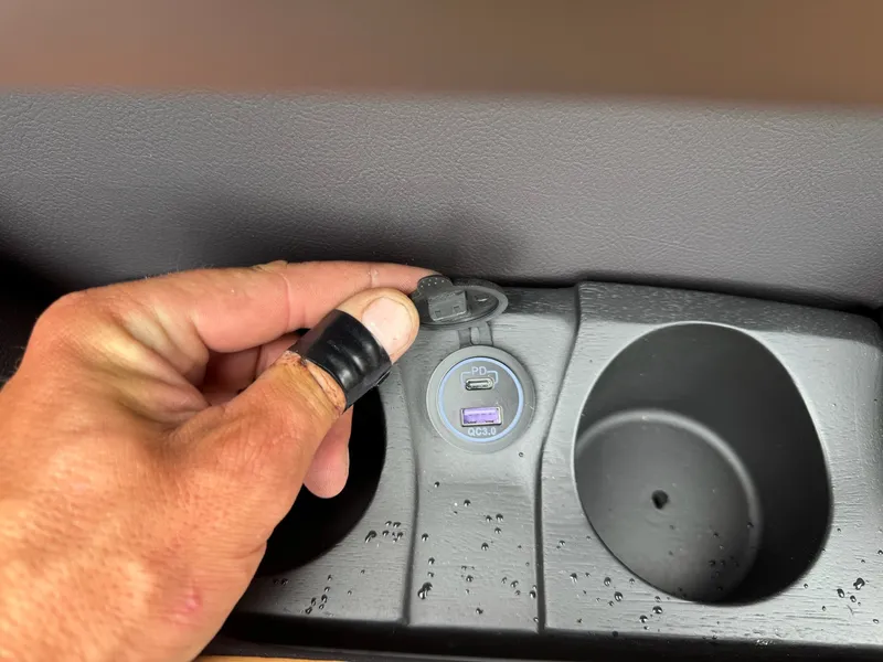 Slide: The Image of Close-up of a USB port and cup holder on a boat. - 37