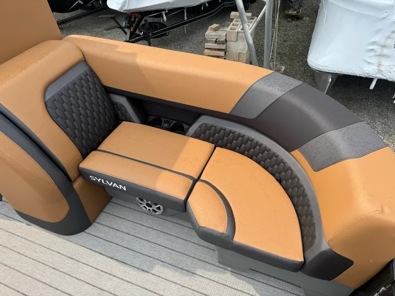 Slide: The Image of The image shows a luxurious, cushioned seating area on a Sylvan L3 RLZ boat. - 25