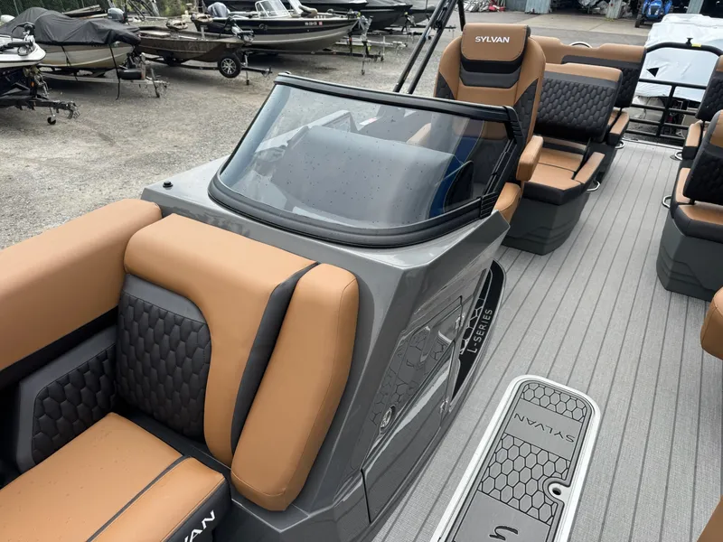Slide: The Image of The image shows the cockpit of a 2026 Sylvan L3 RLZ boat with beige and gray seating. - 6