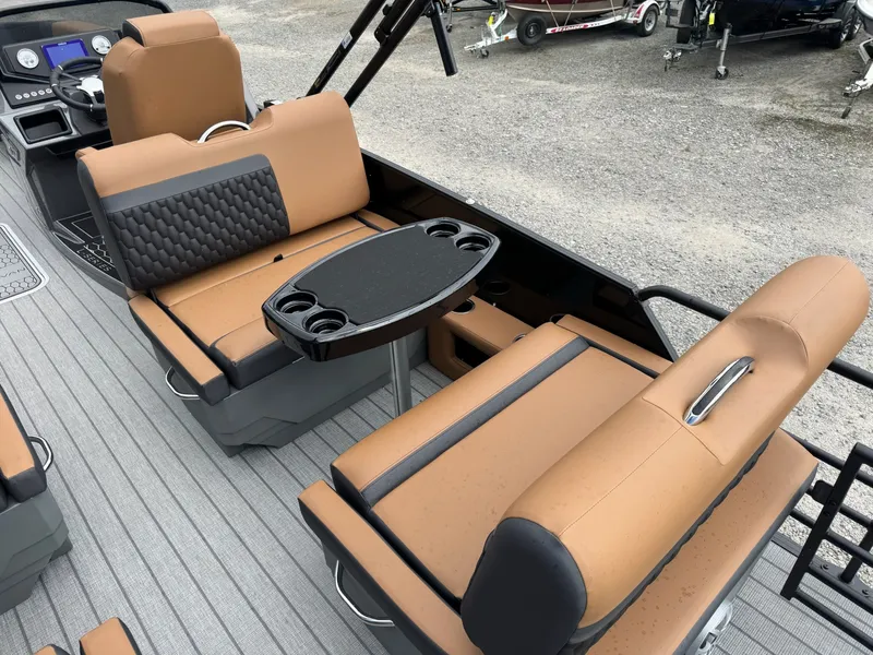 Slide: The Image of The image shows the interior of a 2026 Sylvan L3 RLZ with beige and black seating. - 17