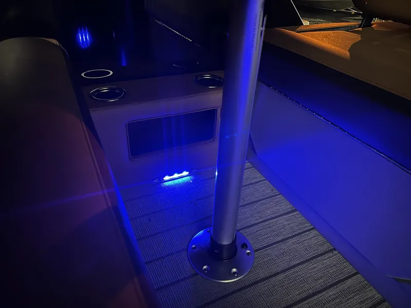 Slide: The Image of Interior of a Sylvan L3 RLZ with blue LED lighting and cup holders. - 18