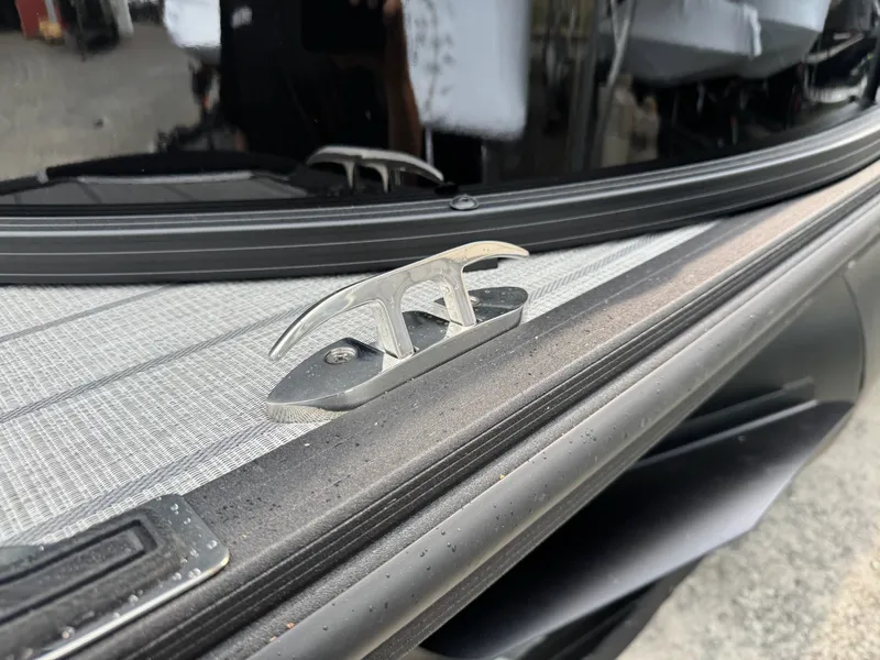 Slide: The Image of Close-up of a boat deck featuring a silver cleat fitting. - 41