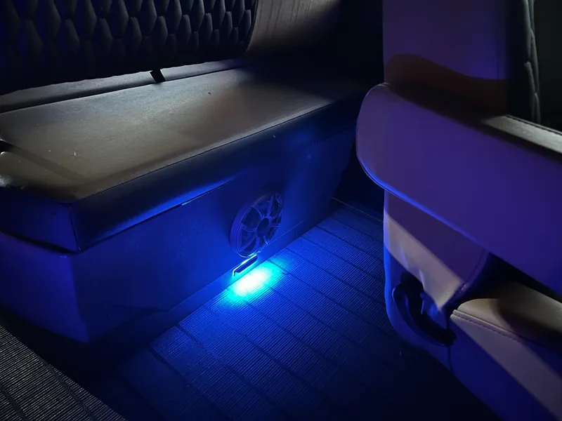 Slide: The Image of The interior of a 2026 Sylvan L3 RLZ features a bench seat with blue LED lighting. - 30