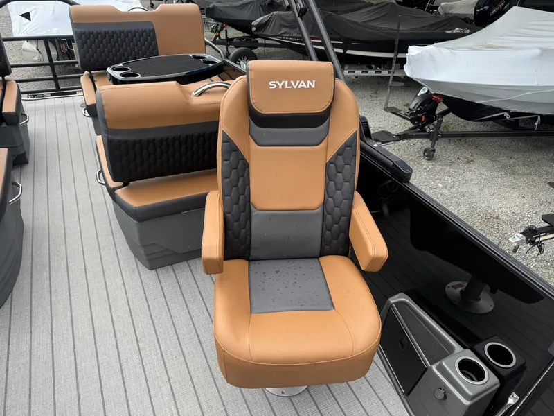 Slide: The Image of A modern boat seat with brown and black upholstery, surrounded by additional seats and boat equipment. - 4