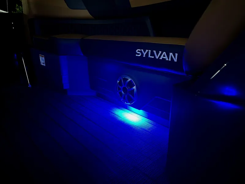 Slide: The Image of The image shows the interior of a Sylvan L3 RLZ boat with blue LED lighting. - 13
