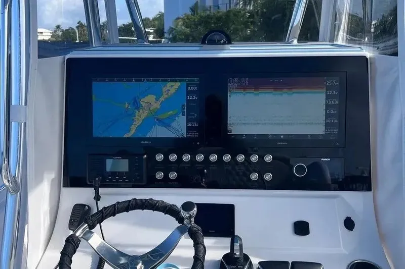 Slide: The Image of 2024 Contender 30 Tournament boat dashboard with navigation screens and controls. - 7