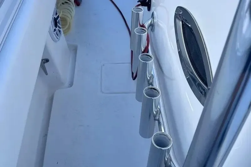 Slide: The Image of 2024 Contender 30 Tournament boat deck with rod holders and speaker. - 14
