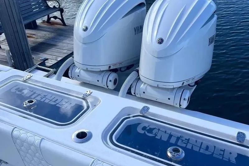 Slide: The Image of 2024 Contender 30 Tournament boat with dual Yamaha outboard engines at dock. - 23
