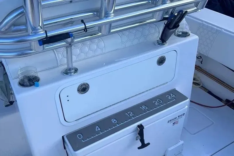 Slide: The Image of 2024 Contender 30 Tournament boat console with measuring scale and rod holders. - 19