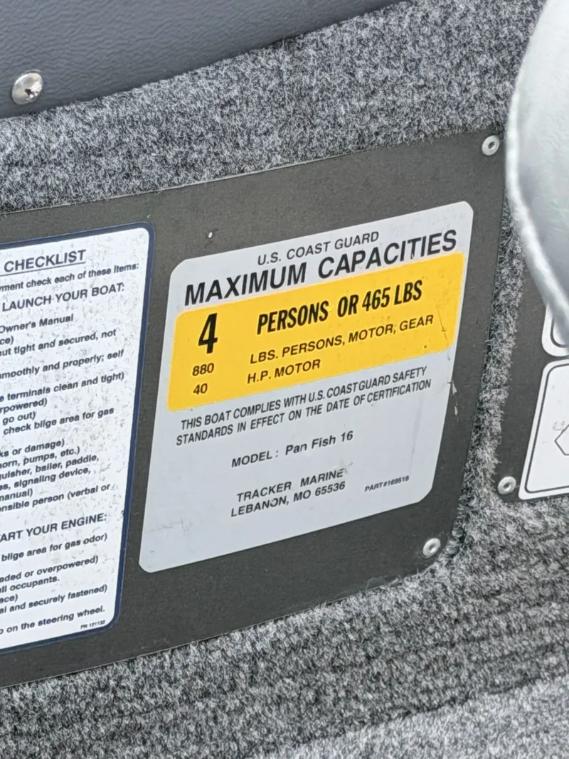 Slide: The Image of A sign shows the maximum capacity of the Tracker Panfish 16 boat: 4 persons or 465 pounds. - 20