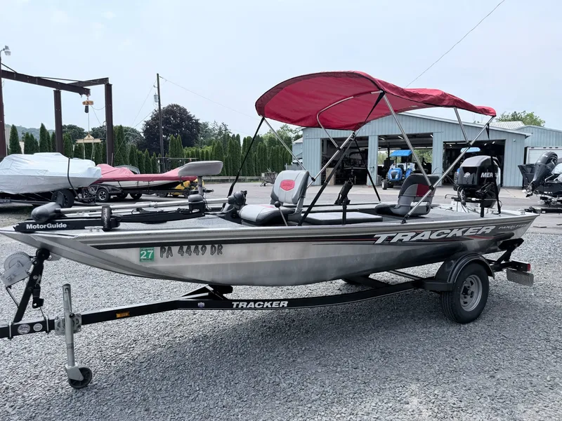 Slide: The Image of A 2016 Tracker Panfish 16 on a trailer with a red sunshade. - 25