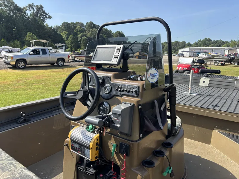 Slide: The Image of The image shows the cockpit of a 2013 G3 1860 CCT boat with steering and electronics. - 15