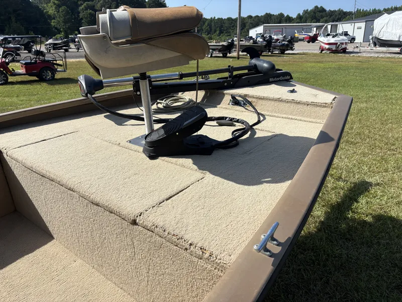 Slide: The Image of A fishing boat with a cushioned seat and a MotorGuide motor on the deck. - 10