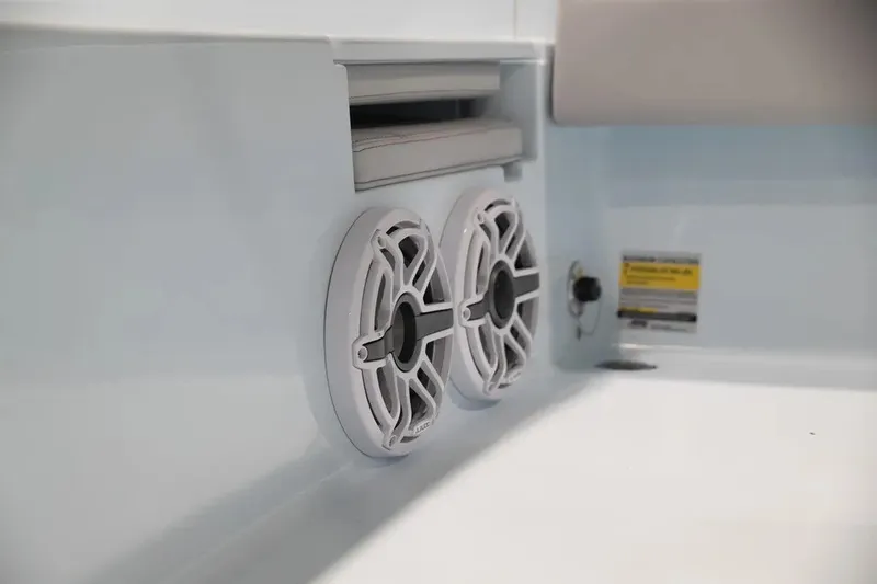 Slide: The Image of 2024 Contender 26 Bay boat interior with dual speakers and sleek design. - 14