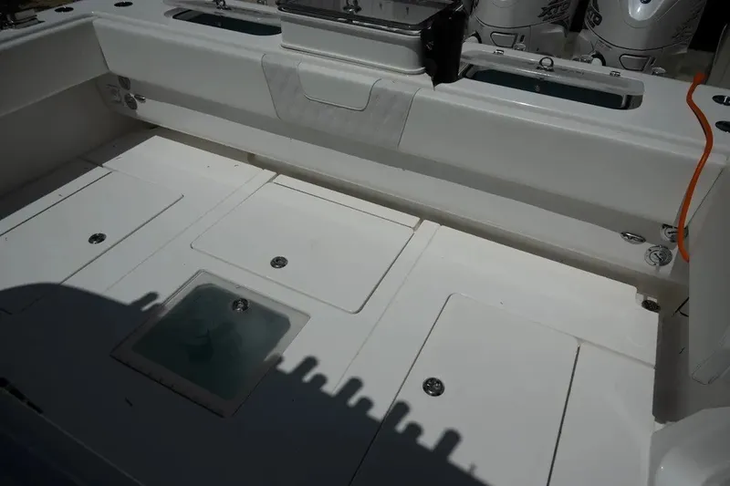 Slide: The Image of 2023 Contender 44 ST boat deck with storage compartments and clean design. - 14
