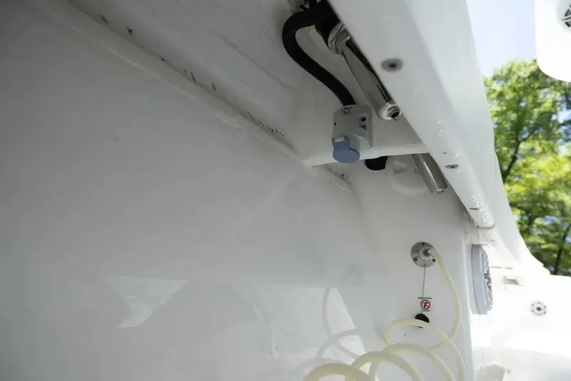 Slide: The Image of 2023 Contender 44 ST boat interior detail with visible wiring and components. - 17