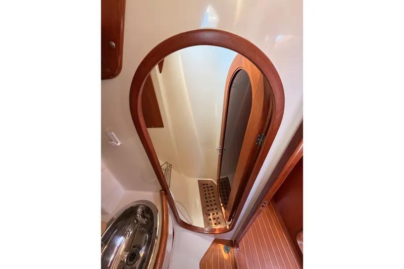 Slide: The Image of Interior of 2005 Tayana 48 yacht showing wooden door and stainless steel sink. - 62