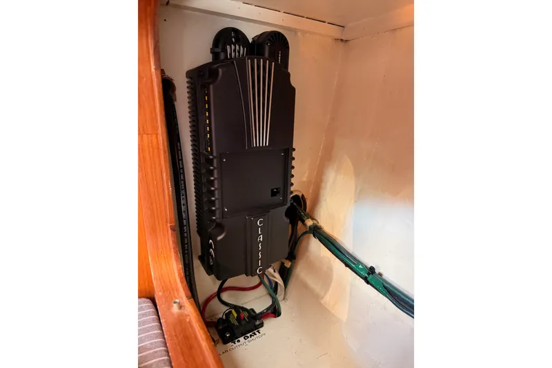 Slide: The Image of Electrical panel inside 2005 Tayana 48 yacht, featuring wiring and control systems. - 122