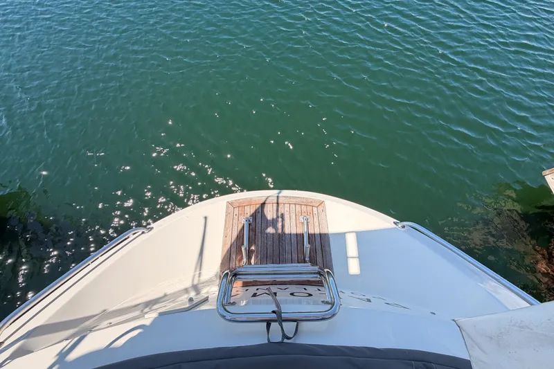 Slide: The Image of Bow view of 2005 Tayana 48 yacht on calm water. - 28