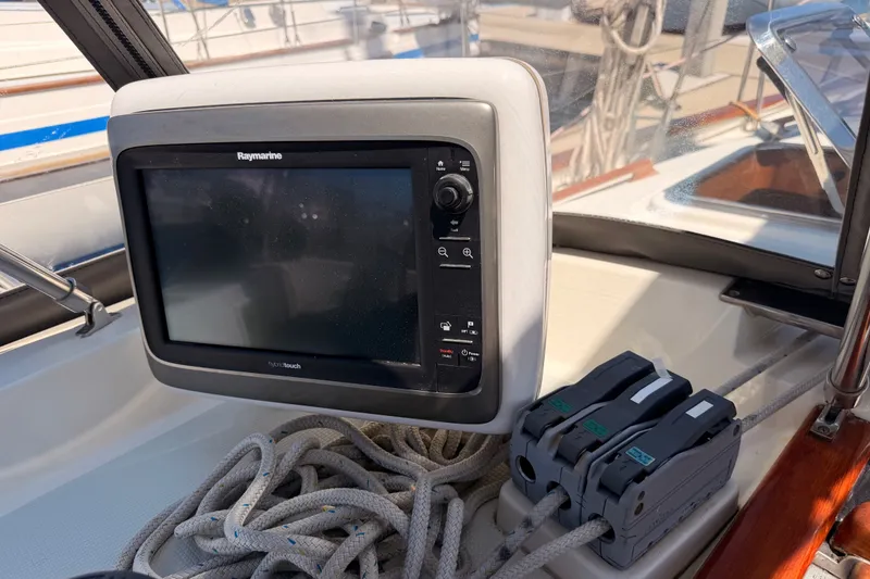 Slide: The Image of Raymarine navigation system on 2005 Tayana 48 yacht, with ropes and control panel. - 44