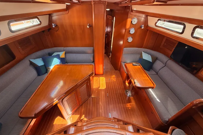 Slide: The Image of Luxurious 2005 Tayana 48 yacht interior with elegant wood finish and comfortable seating. - 45
