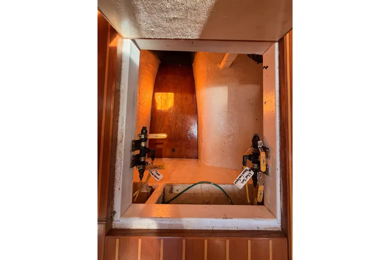 Slide: The Image of Interior view of 2005 Tayana 48 yacht compartment with wooden and metal fittings. - 111