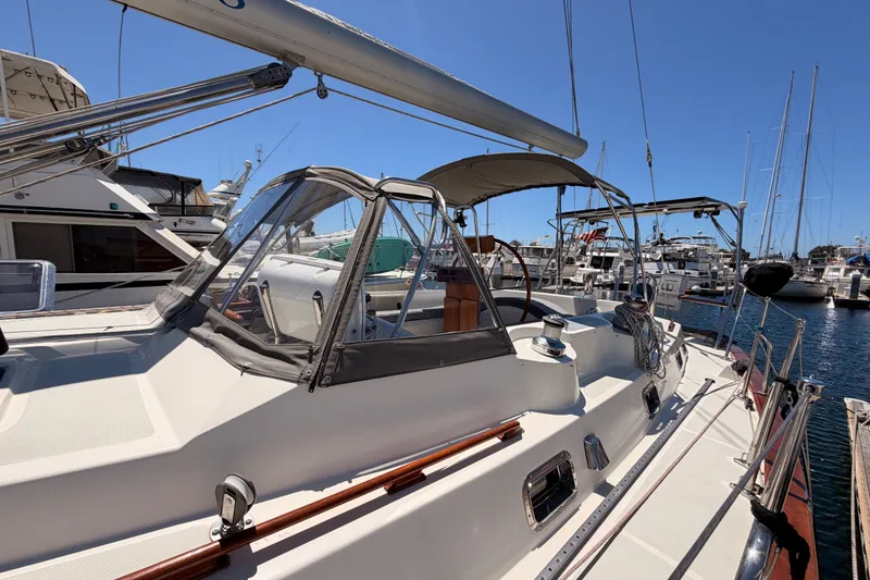 Slide: The Image of Sailboat docked at marina, Tayana 48 model, 2005, with clear skies and surrounding boats. - 7