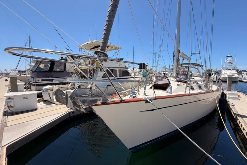 Slide: The Image of Sailboat docked at marina, 2005 Tayana 48 model, clear blue sky background. - 3