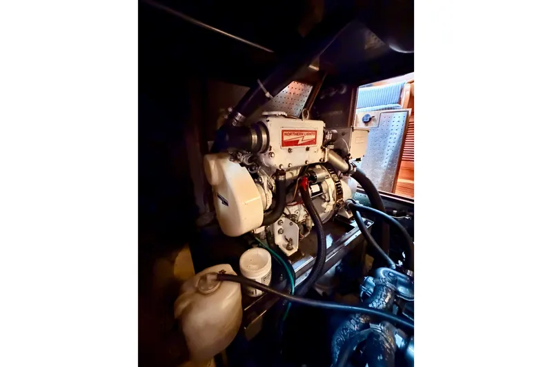 Slide: The Image of Engine compartment of a 2005 Tayana 48 yacht, featuring Northern Lights generator. - 102
