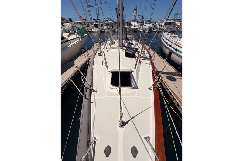 Slide: The Image of Sailboat deck view of 2005 Tayana 48, docked in a marina. - 20