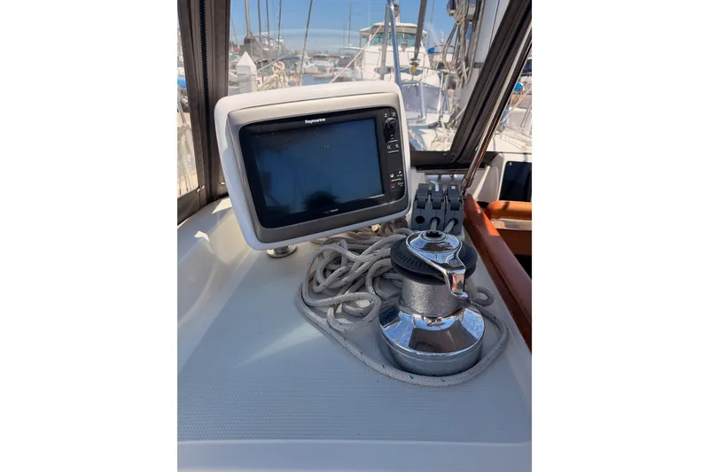 Slide: The Image of Cockpit of 2005 Tayana 48 sailboat with navigation equipment and winch. - 42