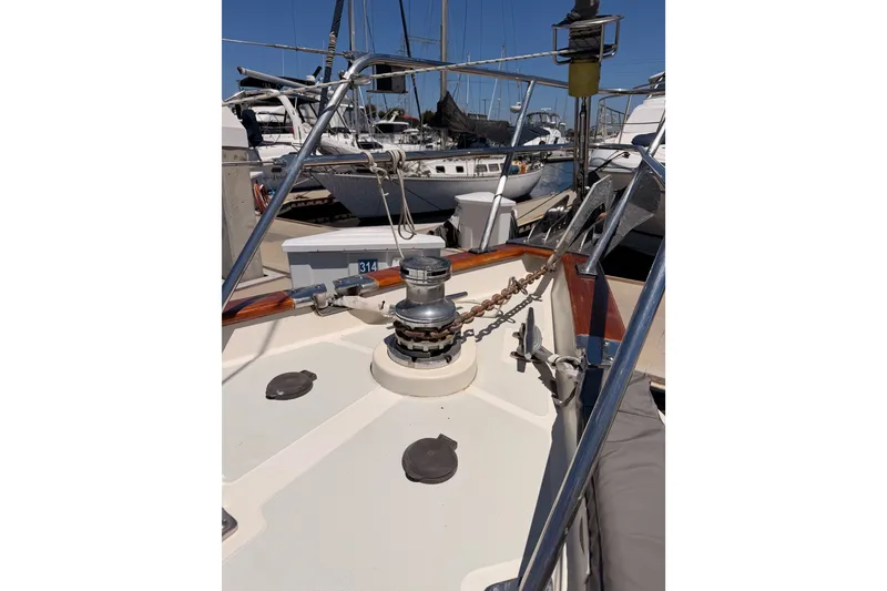 Slide: The Image of Deck view of 2005 Tayana 48 sailboat with anchor chain and winch. - 17