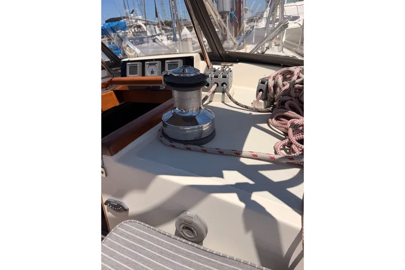 Slide: The Image of Cockpit of 2005 Tayana 48 sailboat with winch and ropes, showcasing nautical equipment. - 41