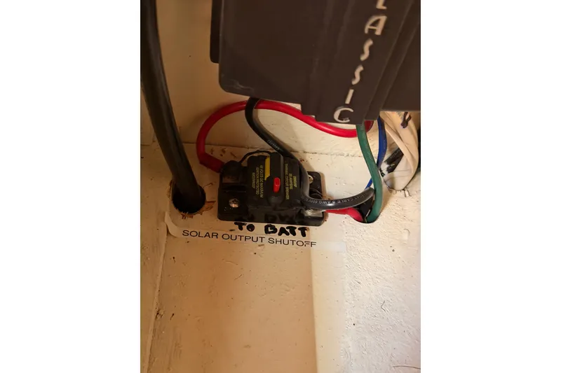 Slide: The Image of Solar output shutoff switch with wiring in a 2005 Tayana 48 yacht. - 123