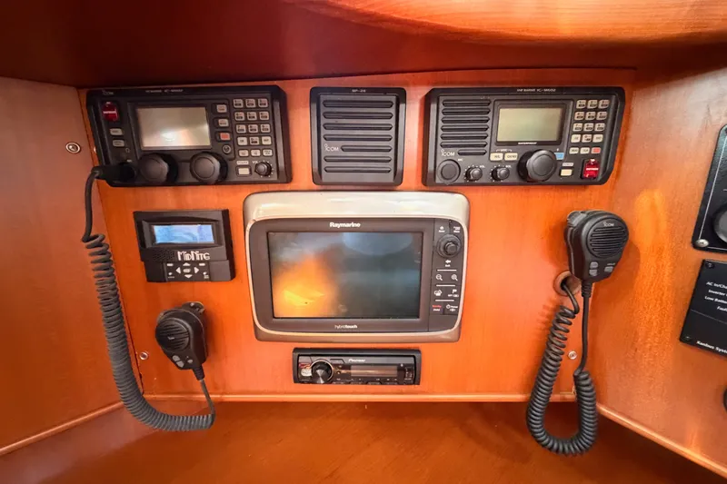 Slide: The Image of Navigation and communication equipment on a 2005 Tayana 48 yacht control panel. - 53