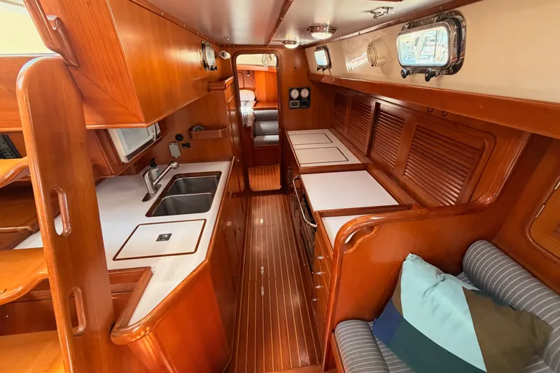 Slide: The Image of Interior of 2005 Tayana 48 yacht with wooden cabinetry and modern amenities. - 76