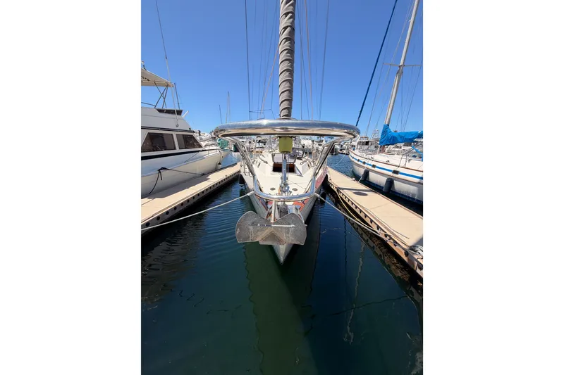 Slide: The Image of Sailboat Tayana 48, 2005 model, docked at marina under clear blue sky. - 1
