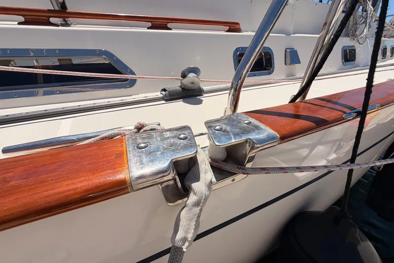 Slide: The Image of 2005 Tayana 48 yacht deck with polished wood and stainless steel fittings. - 6