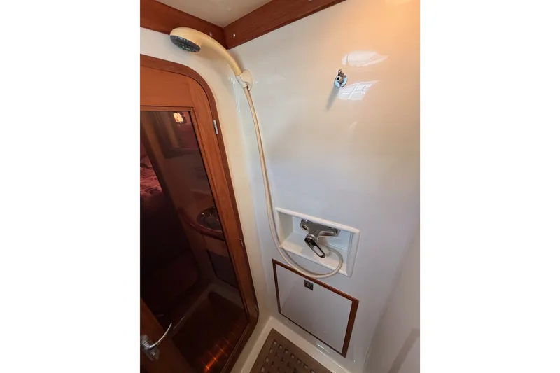 Slide: The Image of Shower area in 2005 Tayana 48 yacht, featuring wooden accents and modern fixtures. - 93