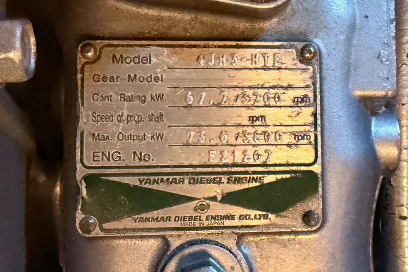Slide: The Image of Yanmar diesel engine plate on 2005 Tayana 48, displaying model and specifications. - 103