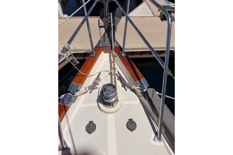 Slide: The Image of Bow of 2005 Tayana 48 sailboat with anchor chain and windlass. - 18