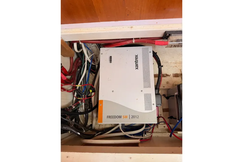 Slide: The Image of Xantrex Freedom SW 2012 inverter in a 2005 Tayana 48 yacht's electrical compartment. - 121