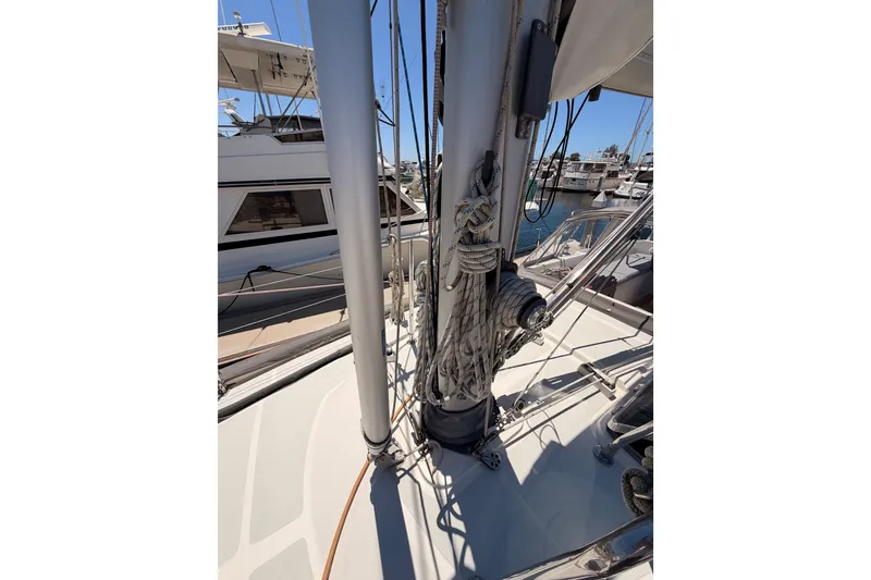 Slide: The Image of 2005 Tayana 48 sailboat deck with mast and rigging in marina. - 14